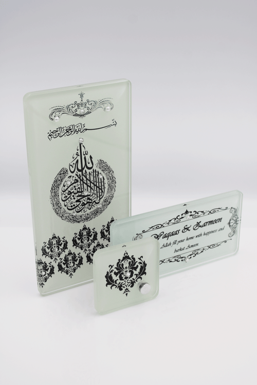 A set of three connected picture frames with Arabic calligraphy and decorative elements in black, clear, and ivory colors.